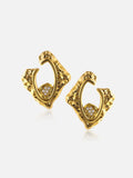 Pair of Tactilery Baroque Frame Stud Earrings in polished gold on a light grey background, the angular diamond-shaped C-hoop with heavily textured molten baroque surface, open center frame, and a small pavé zircon quatrefoil accent at the lower inner corner, shown in three-quarter view