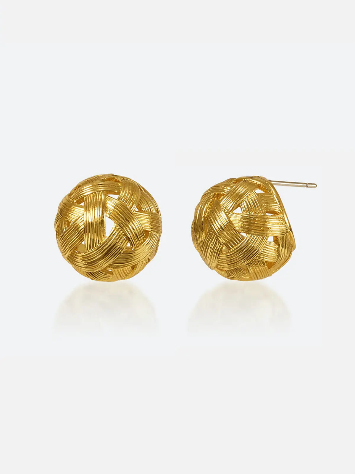 Pair of Tactilery Brushed Woven Gold Ball Stud Earrings in matte brushed gold on a light grey background