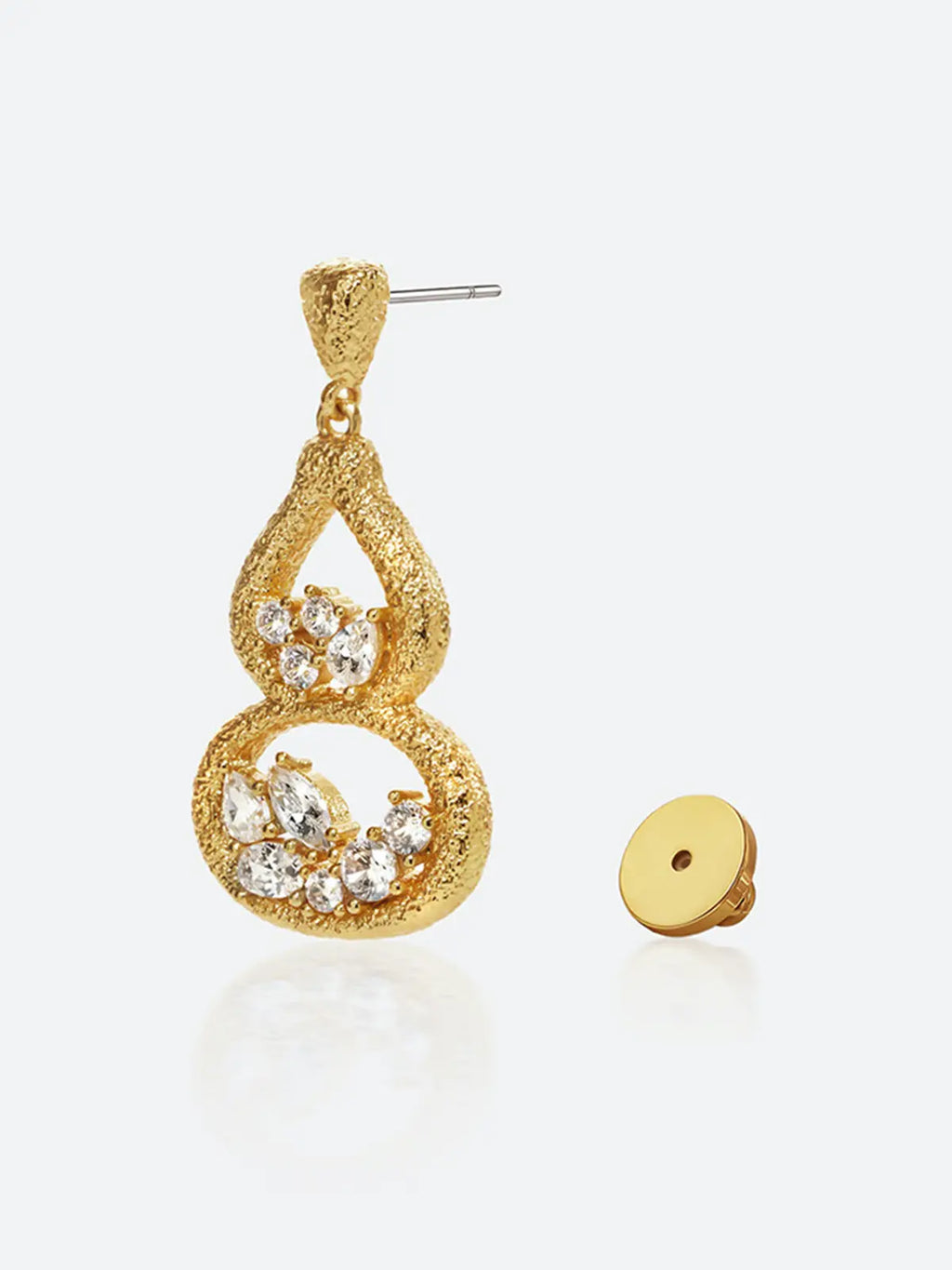 Single Tactilery Gourd Texture Stud Earring in matte brushed gold on a white background with the gold disc butterfly back removed and placed beside it, showing the silver post pin at the textured triangular stud top and the full front face of the double-gourd open frame with mixed-cut zircon clusters in each chamber