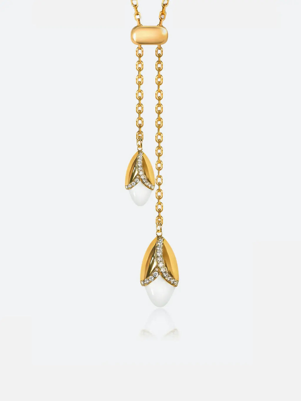 A Tactilery grain rain wheat necklace with two dangling tulip-like charms, each set with small clear stones and ending in a white teardrop bead, shown on a light gray background.