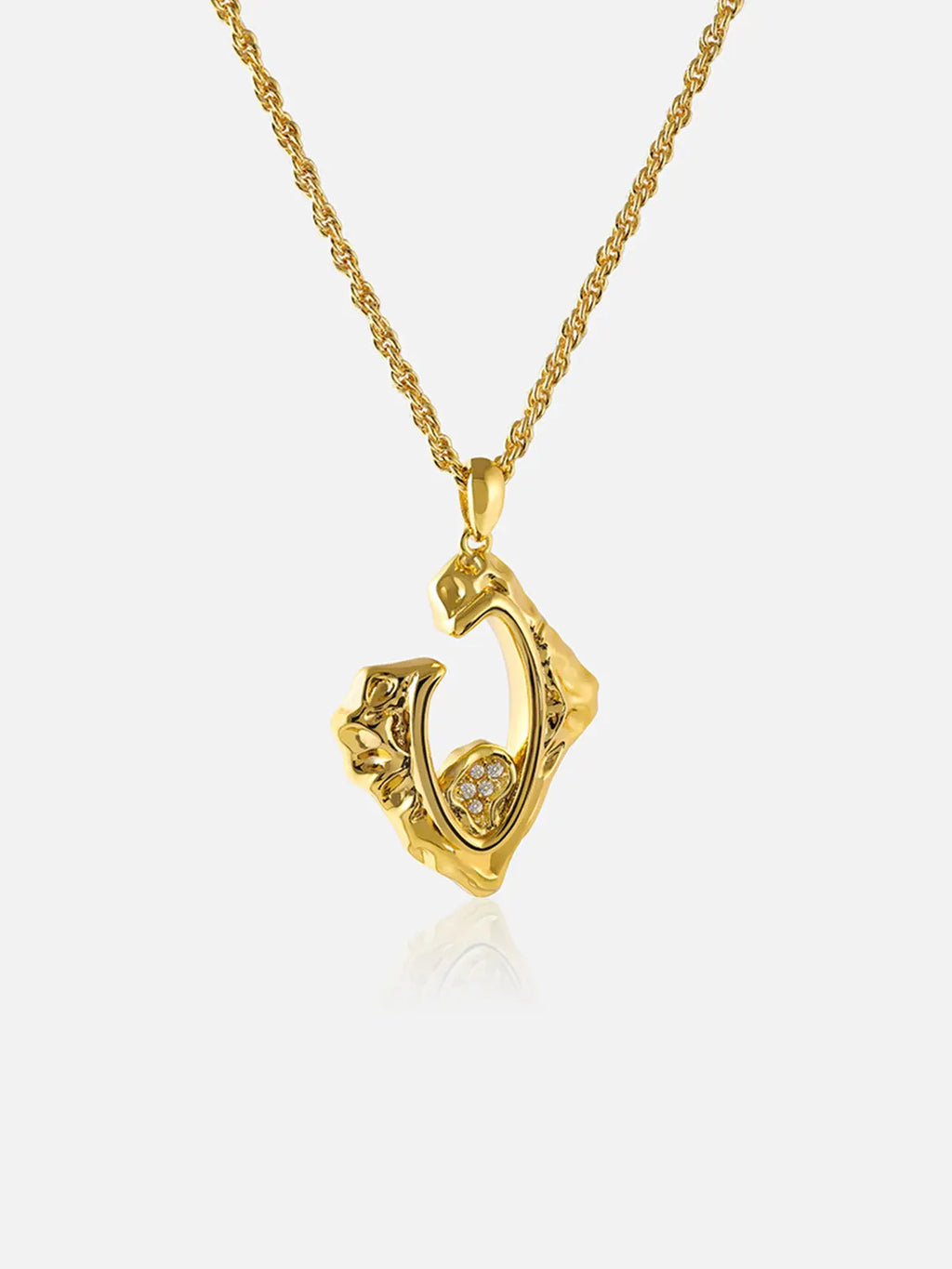 Tactilery Baroque Frame Necklace in polished gold on a white background, the abstract diamond-shaped open-frame pendant with an irregular molten gold border — the asymmetric outline formed by flowing organic ridges and raised sculptural edges — enclosing an open interior with a small pavé zircon four-petal flower cluster accent at the lower center, suspended from a polished gold twisted rope chain with a lobster clasp and oval tag charm extension chain