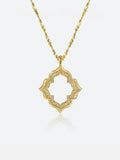 Tactilery Persimmon Calyx Openwork Necklace in polished gold on a white background, the large open-frame four-lobe persimmon calyx flower pendant — each lobe formed by a wide matte sand-textured gold border with a deeply scalloped inner edge lined with continuous pavé zircons, the open interior of each lobe revealing the scalloped pavé zircon inner border — suspended from a fine polished gold twisted petal-link chain with a lobster clasp and oval tag charm extension chain