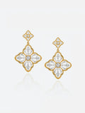 Pair of Tactilery Two-Tone Persimmon Calyx Earrings on a light grey background, the large four-petal flower drop with matte brushed silver sand-textured petals, rope-twist gold border edging each petal, and a central prong-set round zircon, suspended from a small matching four-petal pavé zircon stud top with silver post pins