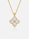 Tactilery Two-Tone Persimmon Calyx Necklace in polished gold and matte brushed silver on a white background, the large two-tone four-petal persimmon calyx flower pendant — the matte brushed silver openwork petal body edged by a fine polished gold milgrain rope border, a central prong-set large round zircon — suspended from a polished gold twisted rope chain with a lobster clasp and oval tag charm extension chain