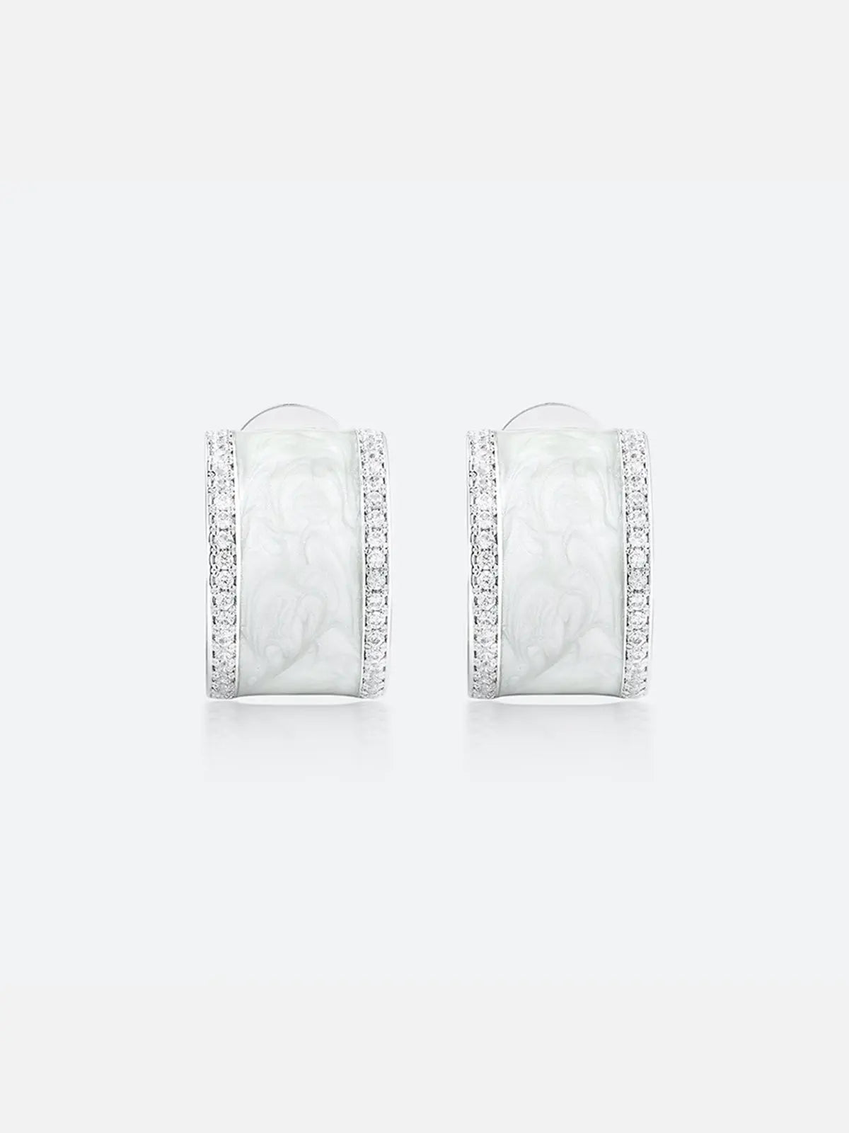 Pair of Tactilery White Glaze Zircon Hoop Earrings displayed face-on on a light grey background, showing the full front face of the wide chunky silver C-hoop with smooth white glaze enamel center panel and two fully pavé zircon rails along the top and bottom edges